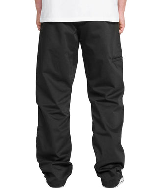 Person wearing black pants on a white background