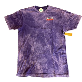 Purple tie-dye t-shirt with a logo on a gray surface