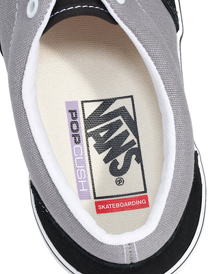 Close-up of a Vans sneaker with brand logo and text on the insole.