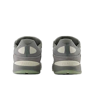 Gray athletic shoes with a focus on sole design on a white background